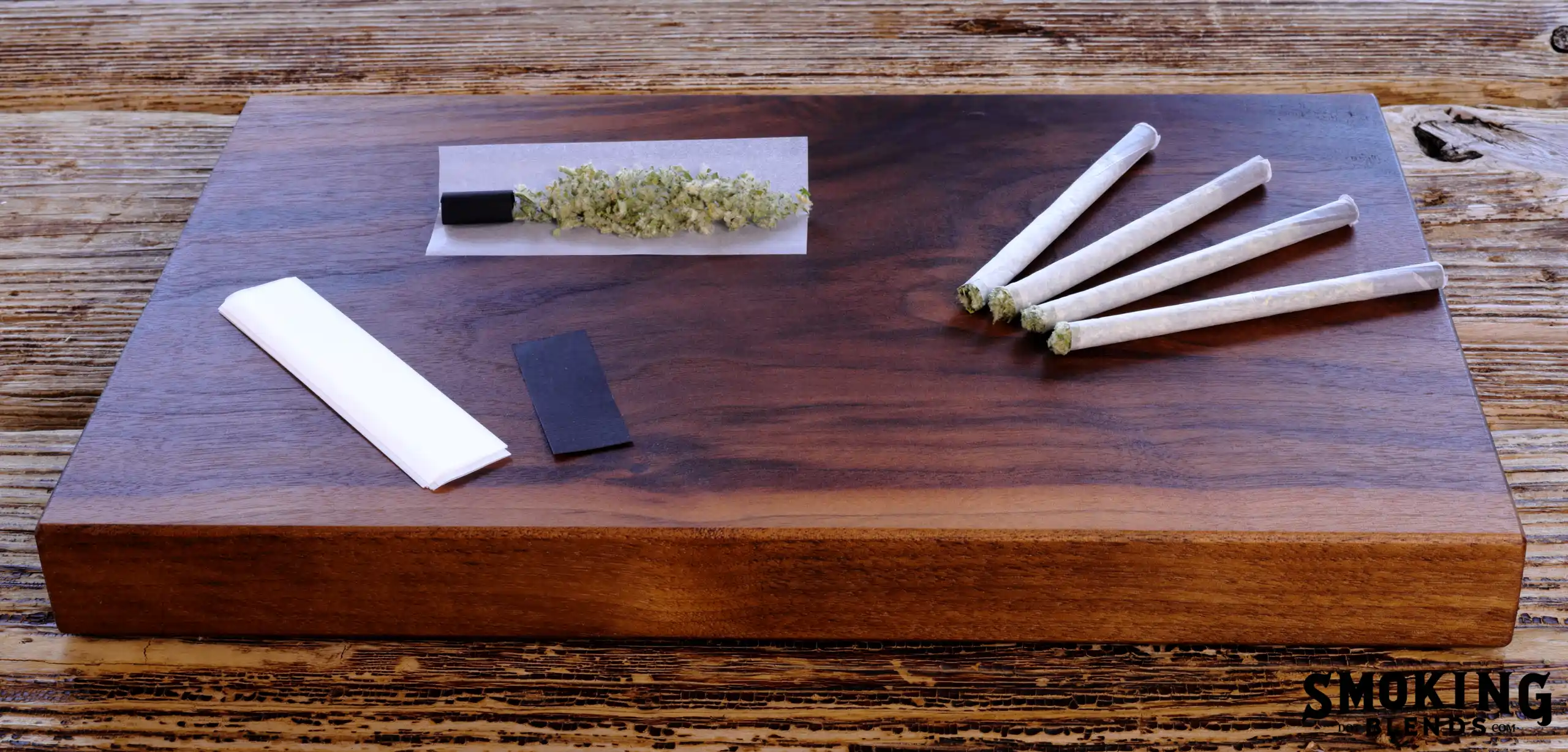 A Rolling Tray with Herbal Cigarettes and Smoking Herbs on It