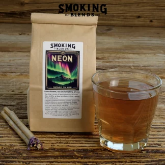 A Package of Neon All Flower Smoking Blend Herbal Smokes and a Glass of Tea