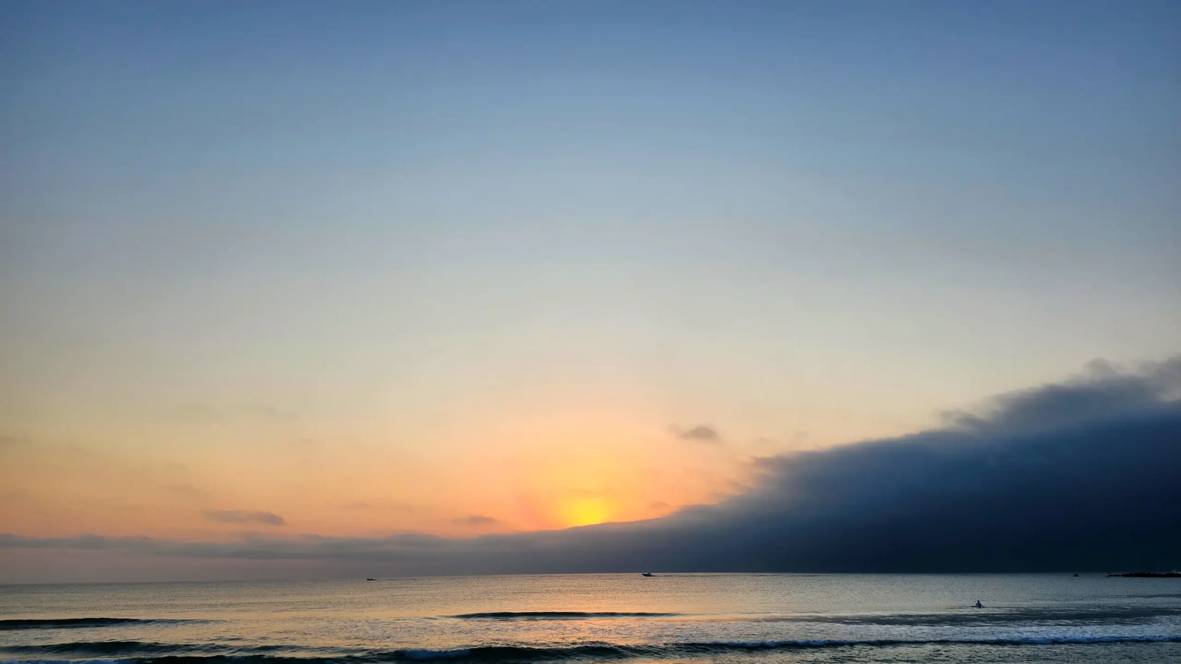 Sunrise on Florida's East Coast with Surfer and Boat