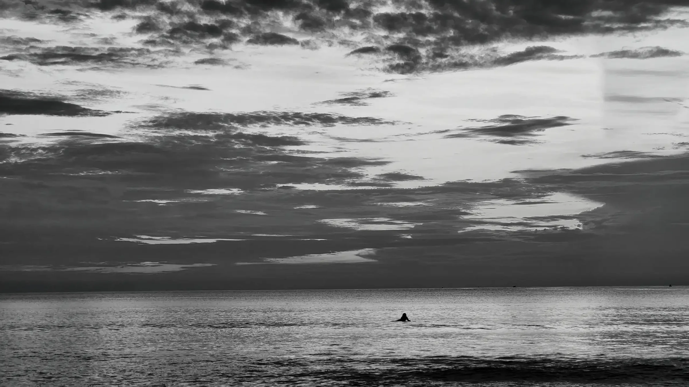 Surfer Paddling Out