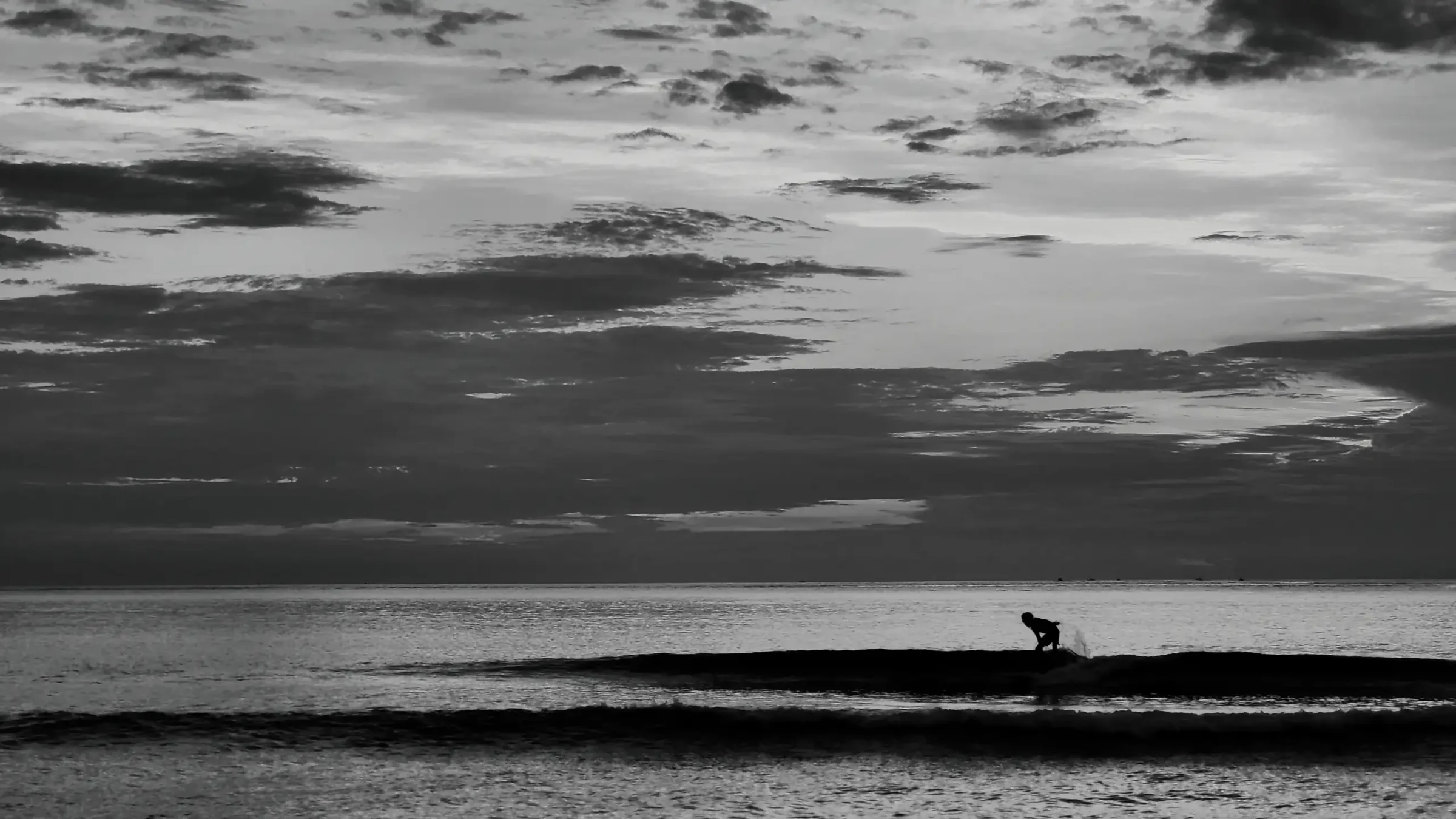 Surfer Riding a Wave