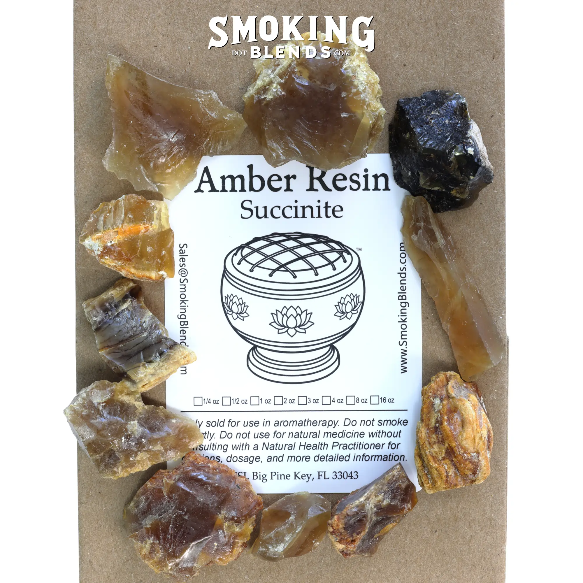 Multiple amber resin chunks in varying natural colors and sizes arranged around a SmokingBlends.com amber resin (succinite) product label. The label states, "Only sold for use in aromatherapy. Do not smoke directly. Do not use for natural medicine without consulting with a Natural Health Practitioner for cautions, dosage, and more detailed information."