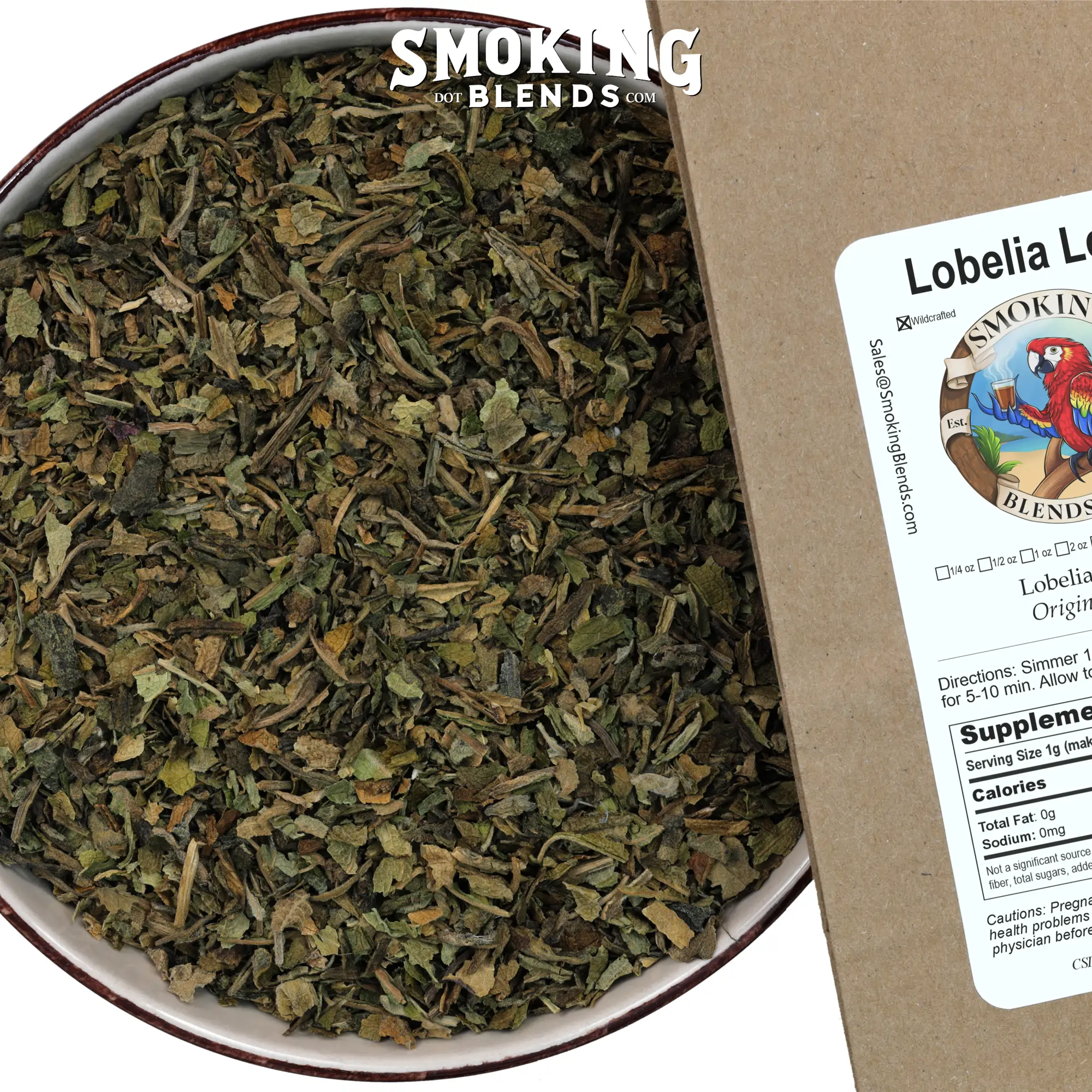 Close-up view of dried, cut, and sifted Lobelia Inflata leaf filling a teal ceramic bowl, positioned next to a brown SmokingBlends.com product bag showing the "Lobelia Leaf" label with a parrot logo and "Origin: USA" text.