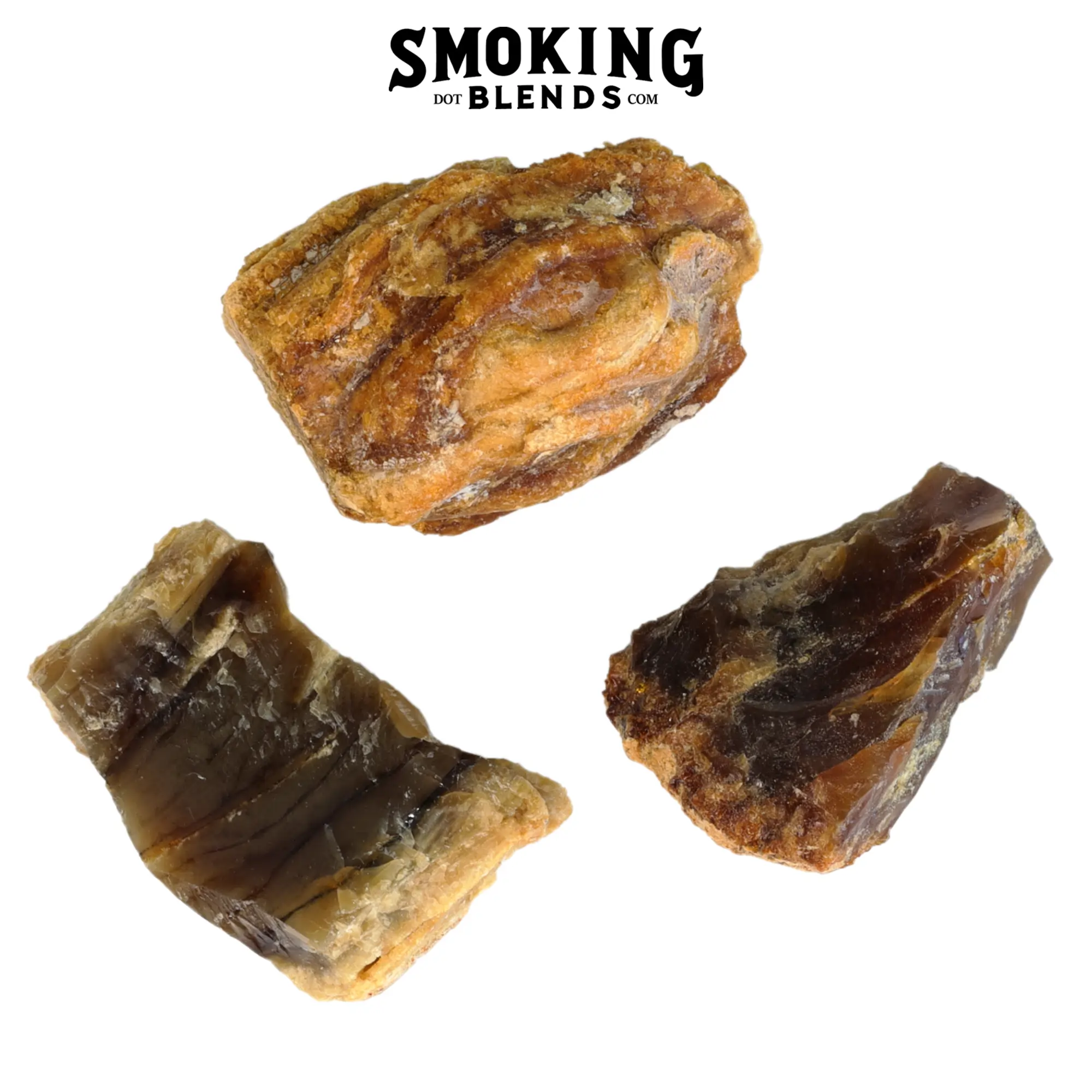 Three diverse pieces of raw amber resin incense—a marbled light golden chunk, a banded dark brown wedge, and a jagged dark amber piece—on a white background. Product image by SmokingBlends.com.