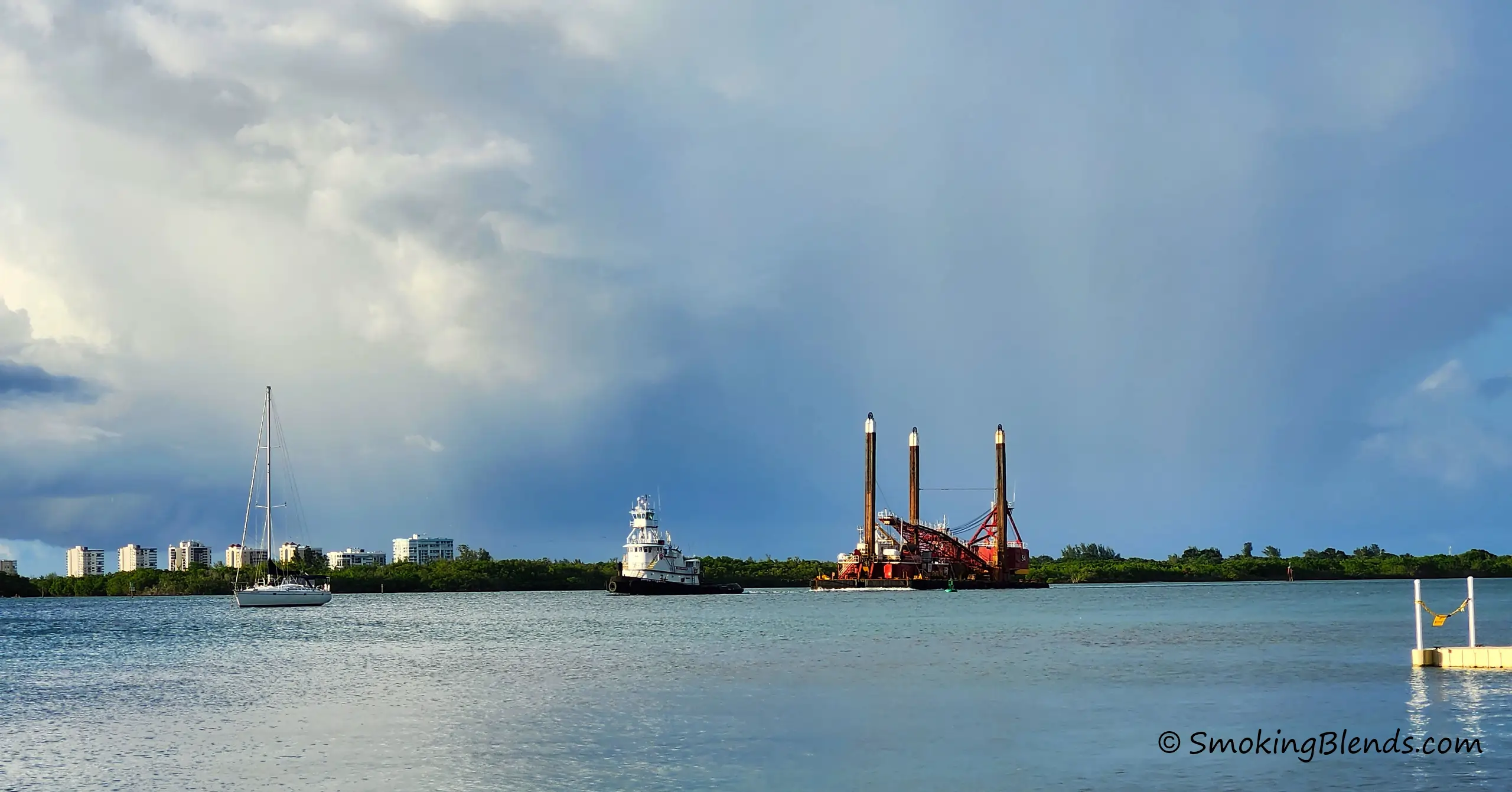 Return Policy Featured Image (A Scenic View of a Tugboat Towing a Dredge into the Inlet).